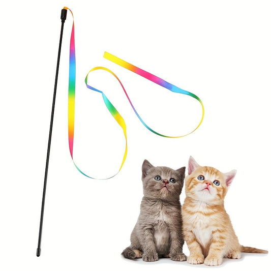 Two kittens sitting beside a rainbow ribbon wand cat toy – interactive play accessory
